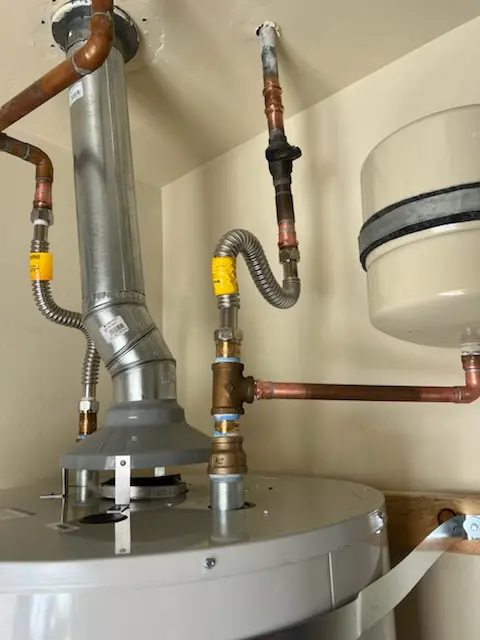 Water heater installation and plumbing repair in Charing Cross